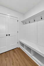 Mudroom with light wood-style floors