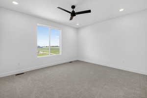Spare room with carpet floors, recessed lighting, and a ceiling fan