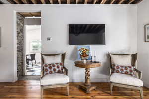 Sitting room with hardwood / wood-style floors and baseboards