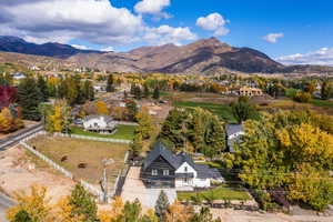 View from above of property with a mountain backdrop