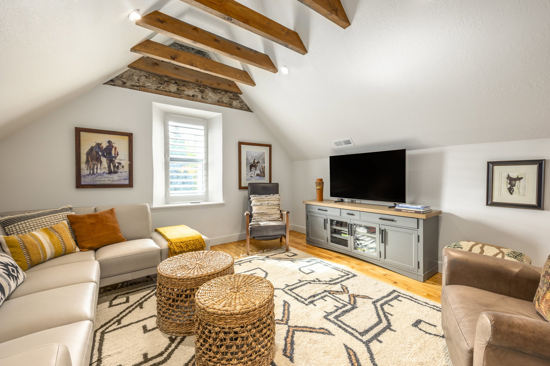 Living area featuring light wood-type flooring and baseboards