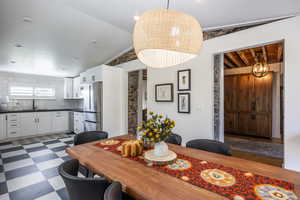 Dining space with dark flooring