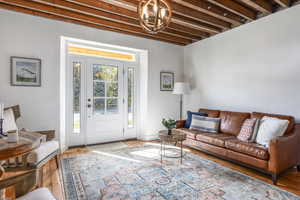 Living area with wood finished floors and baseboards