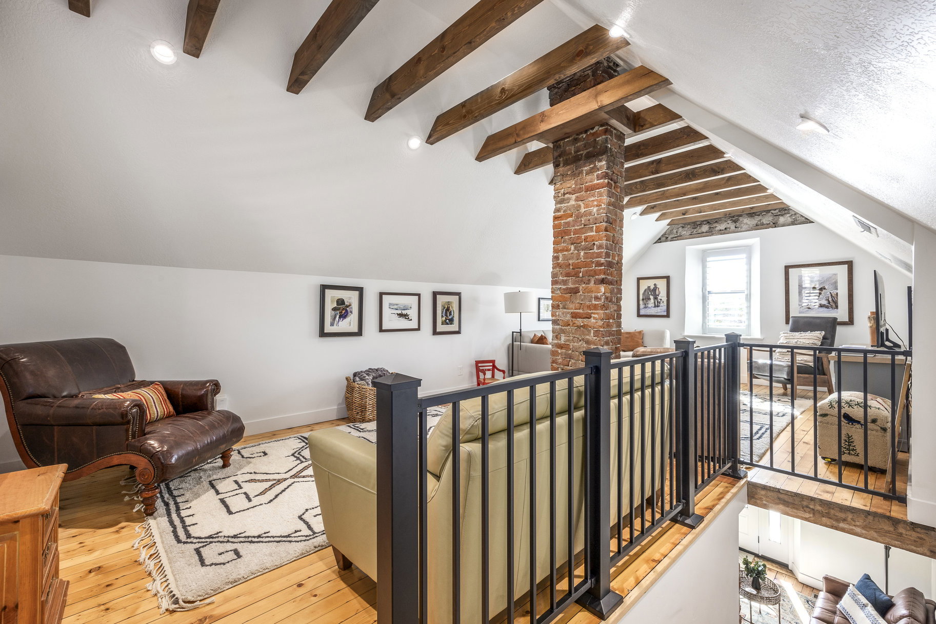 Living area featuring light wood-style floors and baseboards