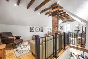 Living area featuring light wood-style floors and baseboards