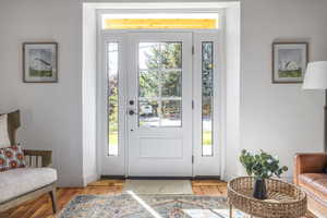 Foyer featuring wood-type flooring