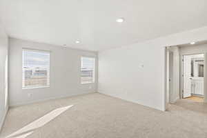 Unfurnished room featuring light colored carpet, recessed lighting, and a textured ceiling