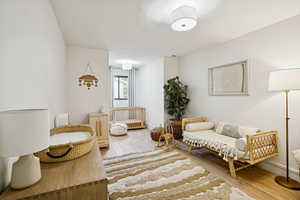 Sitting room featuring light wood-style flooring
