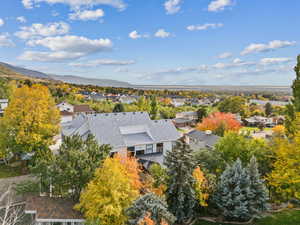 Aerial perspective of suburban area featuring a mountainous background