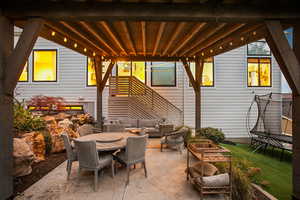 View of patio / terrace with outdoor lounge area, a trampoline, and outdoor dining space