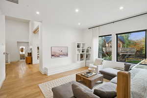Living room featuring recessed lighting and light wood finished floors