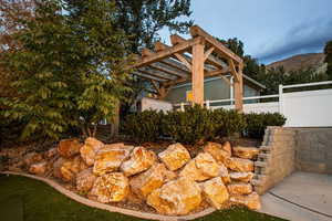 View of yard featuring a mountain view and a pergola