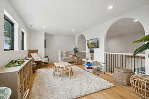 Playroom featuring light wood-style flooring and recessed lighting