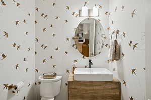 Half bath with vanity and toilet