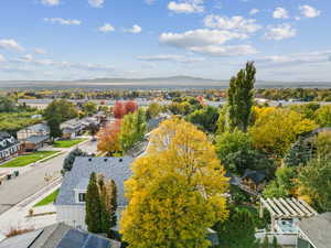 Aerial perspective of suburban area with a mountainous background