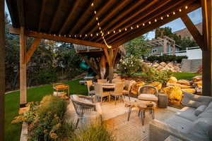 View of patio featuring outdoor dining area and an outdoor hangout area