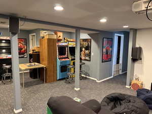 Finished basement with carpet and recessed lighting