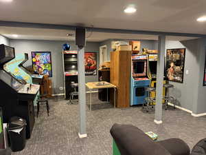 Finished basement with carpet and recessed lighting