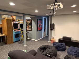 Finished below grade area with carpet floors and recessed lighting