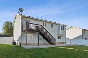 Back of property featuring a gate, a fenced backyard, and a patio