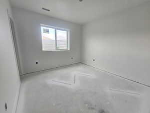 Spare room with concrete flooring