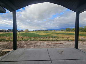 View of yard with a patio area and a rural view