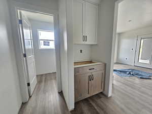 Hall featuring dark wood-type flooring