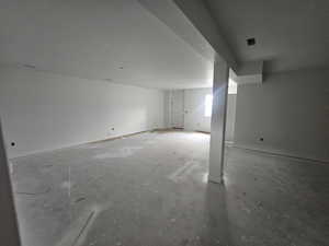 Basement featuring a textured ceiling