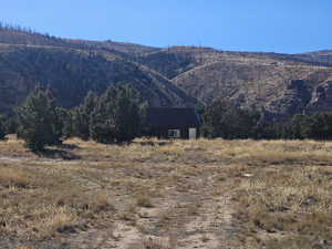 View of mountain backdrop featuring home