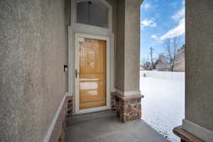 Property entrance with stucco siding