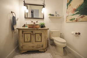 Bathroom featuring vanity and light tile patterned floors