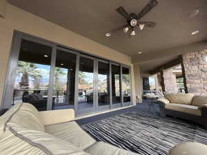 View of patio / terrace with an outdoor living space, ceiling fan, and french doors