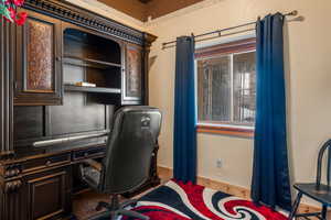 Carpeted office with baseboards