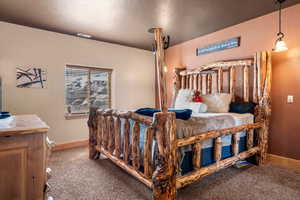 Carpeted bedroom with baseboards