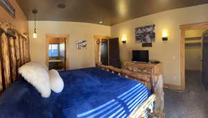 Bedroom featuring carpet floors and a spacious closet