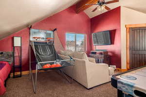 Game room with carpet flooring and a ceiling fan