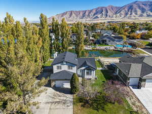 Aerial view of residential area featuring a water and mountain view