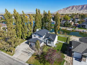 Aerial view of residential area featuring a water and mountain view