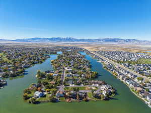 Aerial perspective of suburban area with a water and mountain view