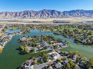 Aerial overview of property's location with nearby suburban area and a water and mountain view