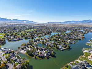 Aerial perspective of suburban area featuring a water and mountain view