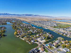 Aerial overview of property's location with nearby suburban area and a water and mountain view