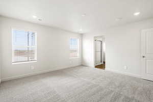 **DISCLAIMER- exterior and interior options will vary**Unfurnished bedroom with carpet floors and recessed lighting