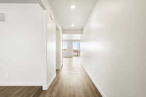 **DISCLAIMER- exterior and interior options will vary**Hall with light wood-style floors and recessed lighting