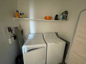 Laundry room with washing machine and clothes dryer