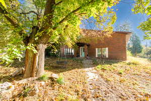 View of front of home featuring brick siding