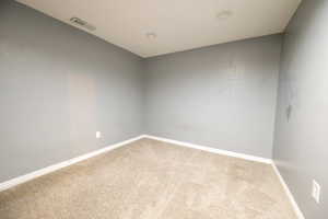 Spare room with carpet floors and recessed lighting