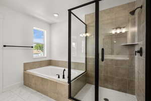 Full bath with a garden tub, a stall shower, and marble look tiles