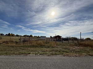 View of yard with a rural view
