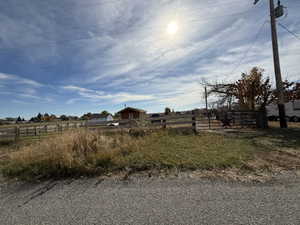 View of yard with a rural view